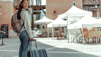 Girl Traveling Abroad With Suitcase